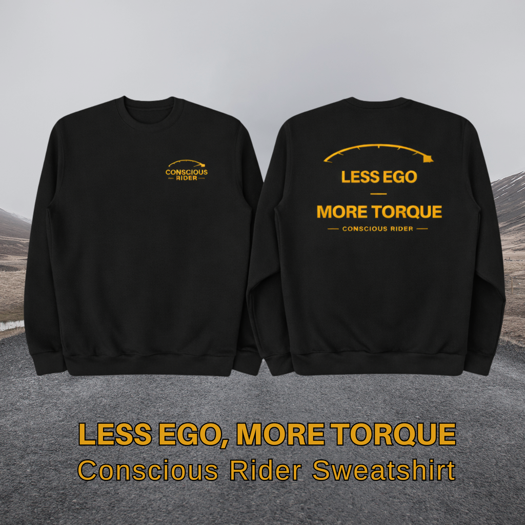 “Black motorcycle crewneck sweatshirt with Conscious Rider front logo and ‘Less Ego More Torque’ graphic on the back, worn by a man on a mountain road.”
